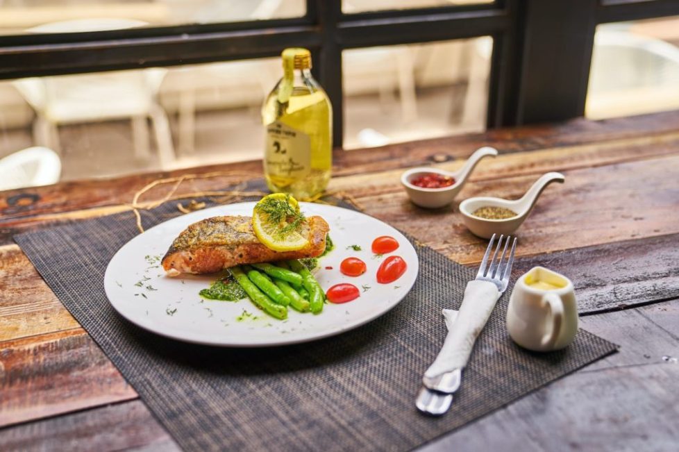 delicious grilled fish and vegetables on plate