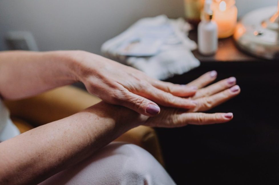 person s hands with manicured nails