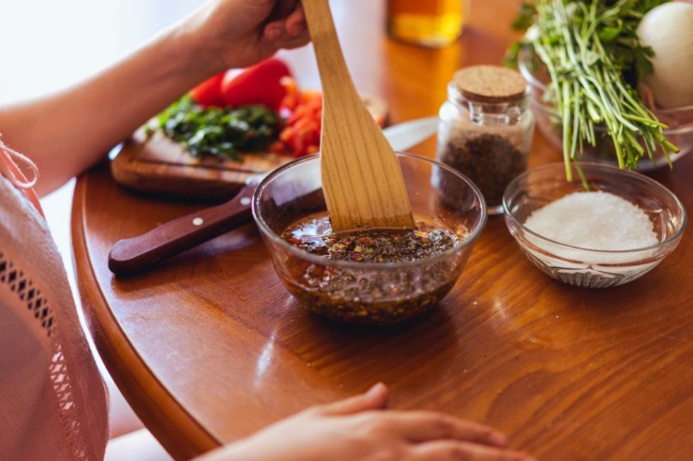 photo of a glass bowl with chimichurri